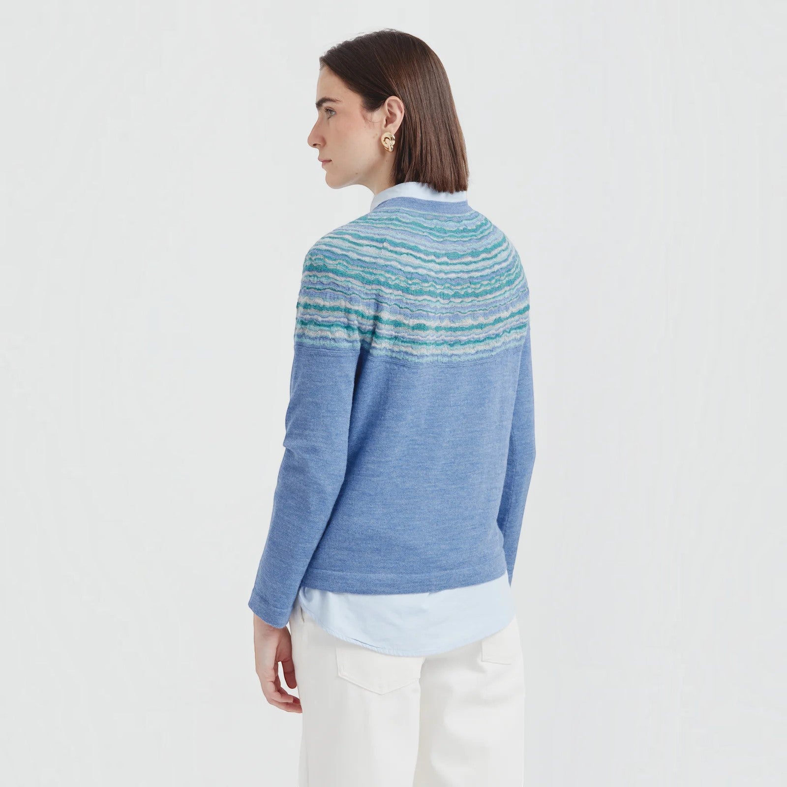 Kuna Canela alpaca knit sweater featuring blue and turquoise textured stripes