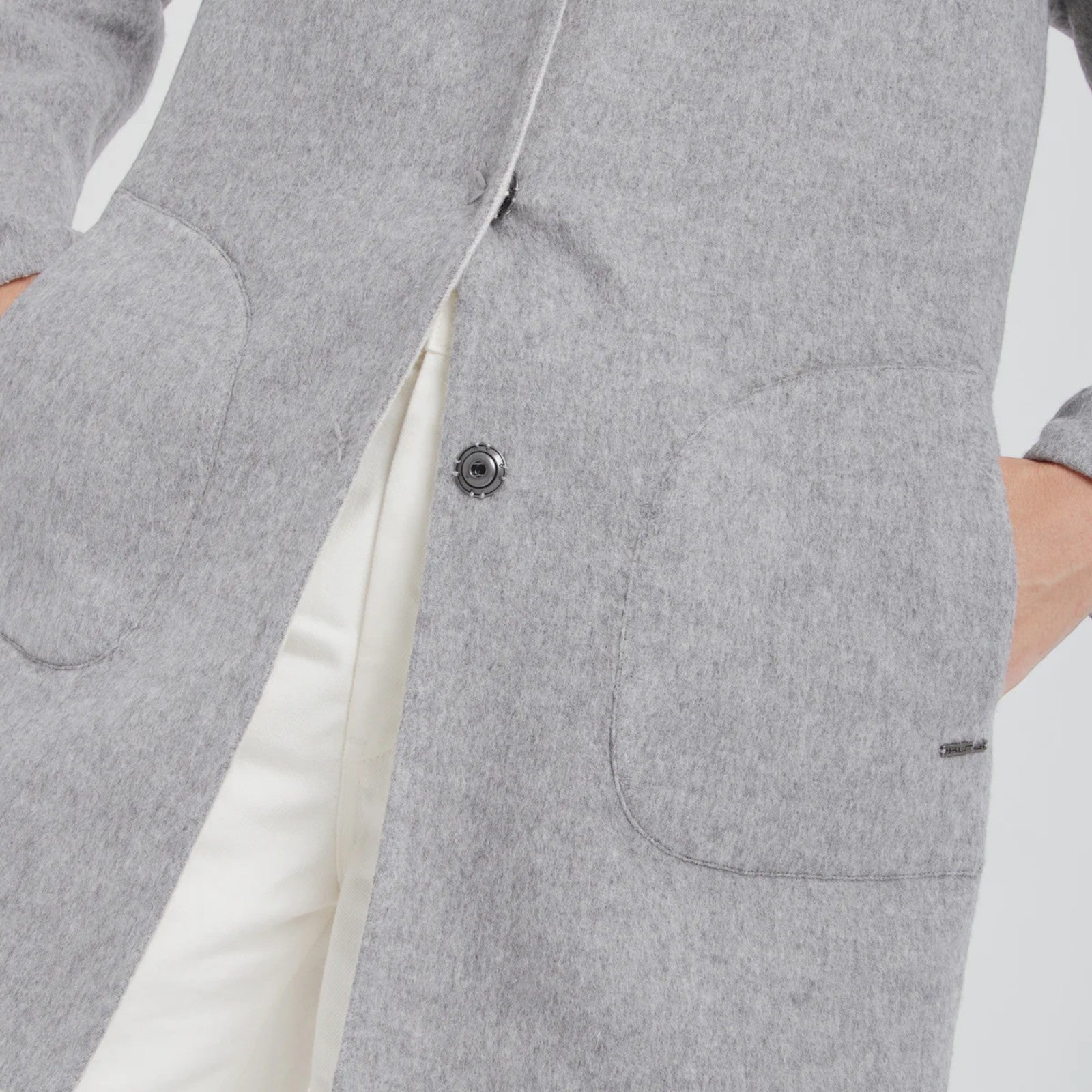 Close-up of Kuna Chantal luxury reversible alpaca coat offering two elegant colourways