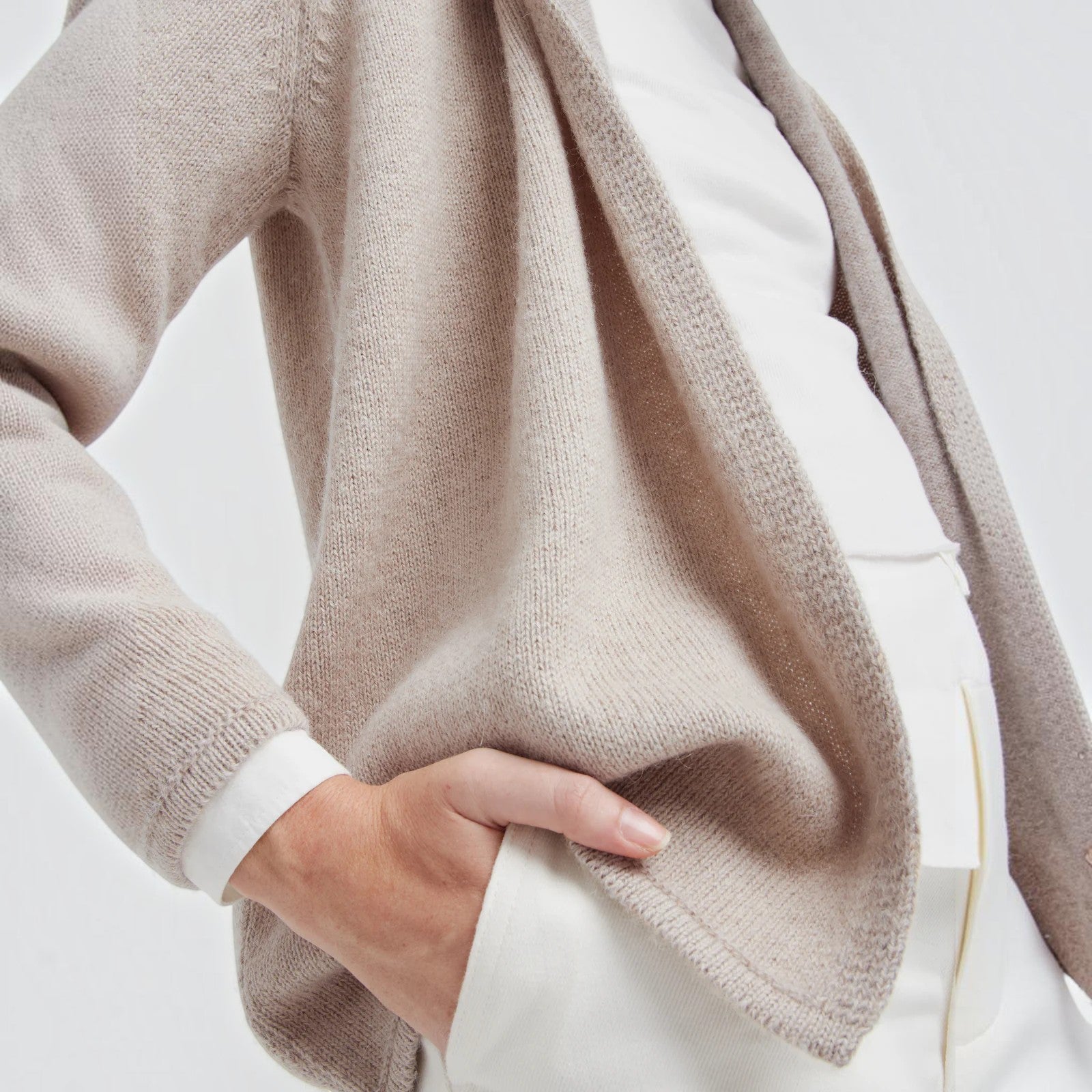 Close up of Coralie beige Baby Alpaca cardigan with relaxed draped front