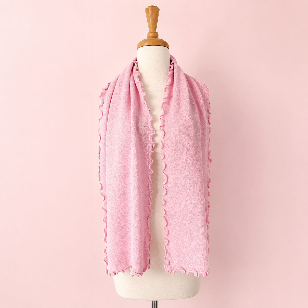 Luxury Peruvian alpaca scarf with textured knit and signature curly edging
