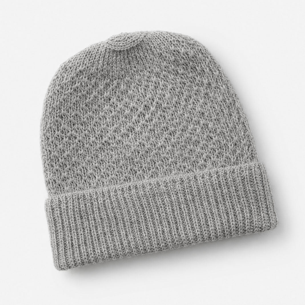 Gray knit alpaca beanie on a light gray background