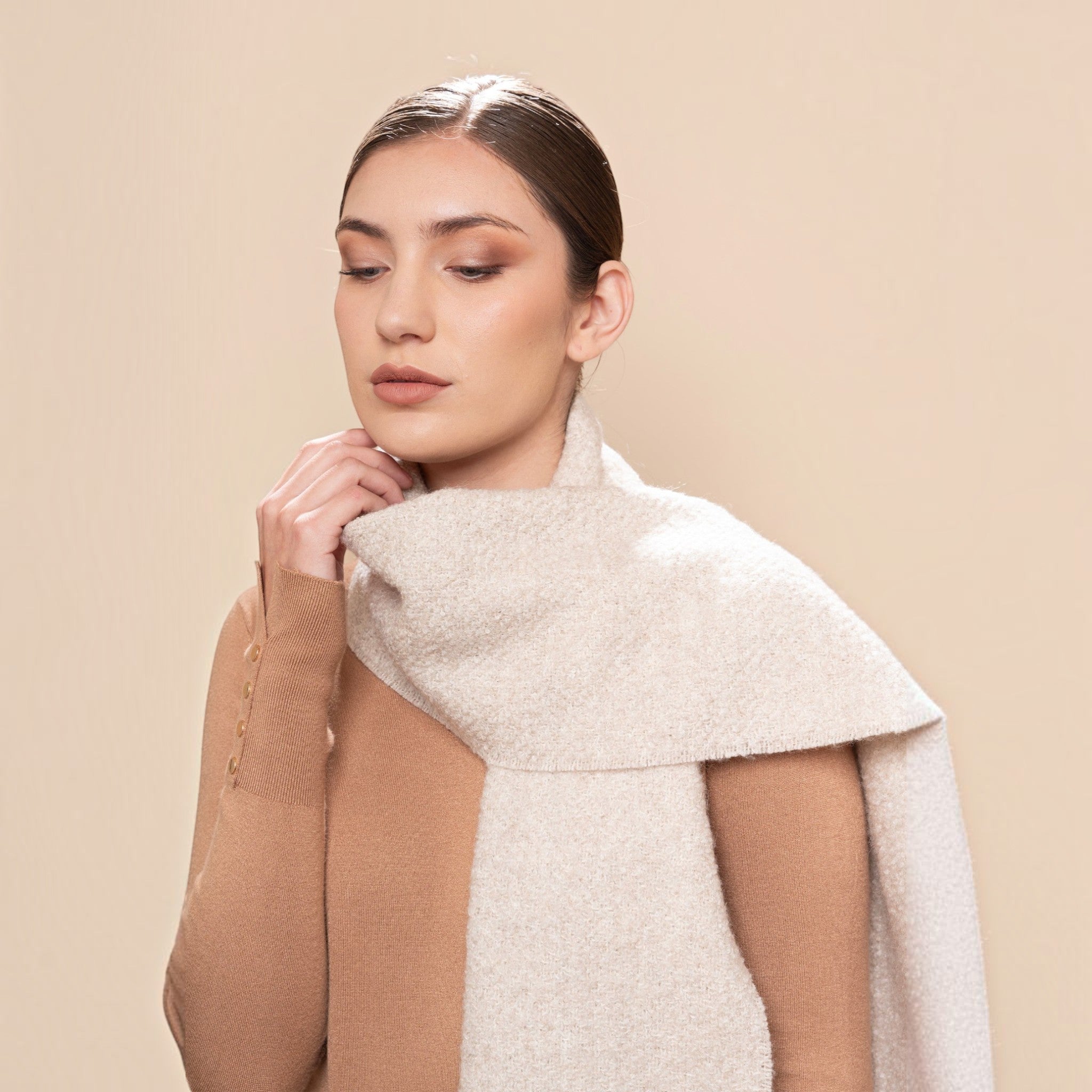 Soft champagne undyed bouclé scarf with textured finish and twisted fringed ends