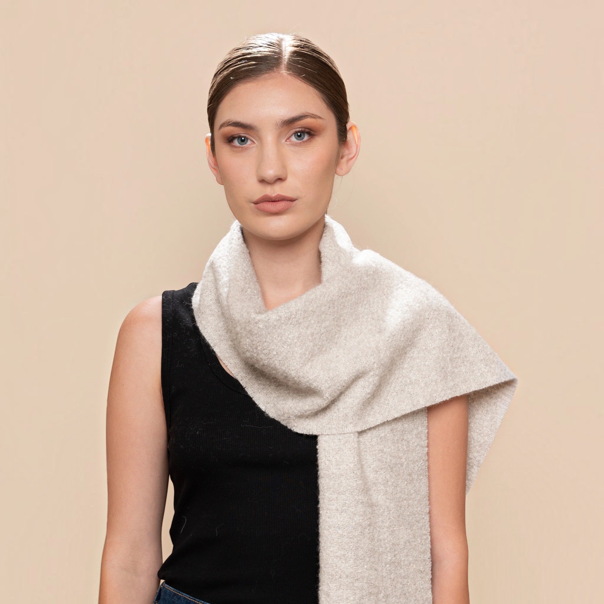 Natural light grey alpaca and silk bouclé scarf styled with a black top and denim