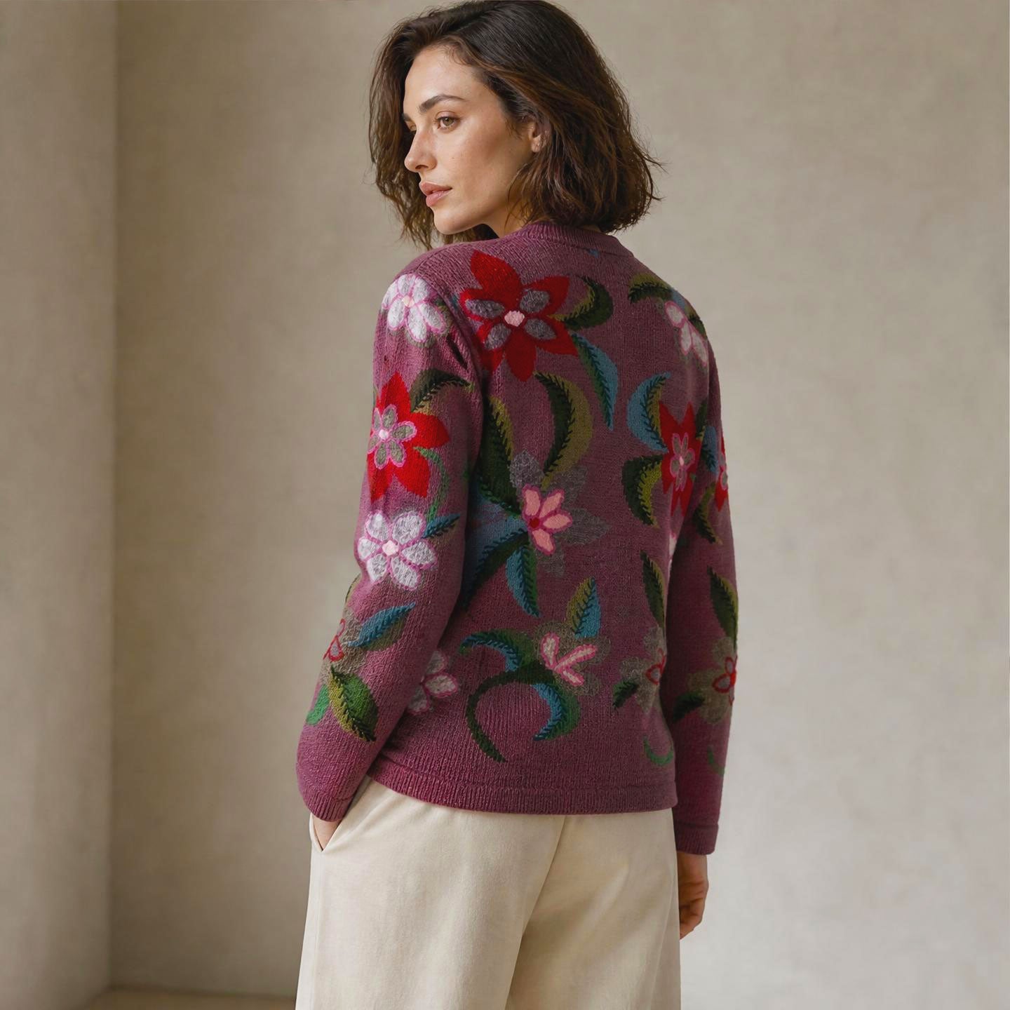 Hand knitted alpaca cardigan in plum with artisan floral design