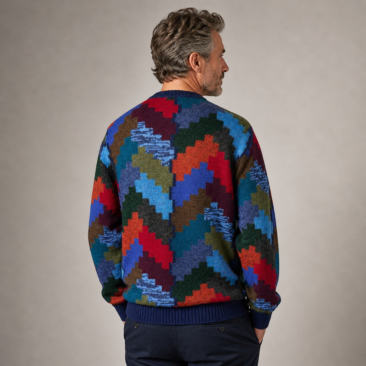 Man wearing a colourful geometric-patterned Baby Alpaca sweater 