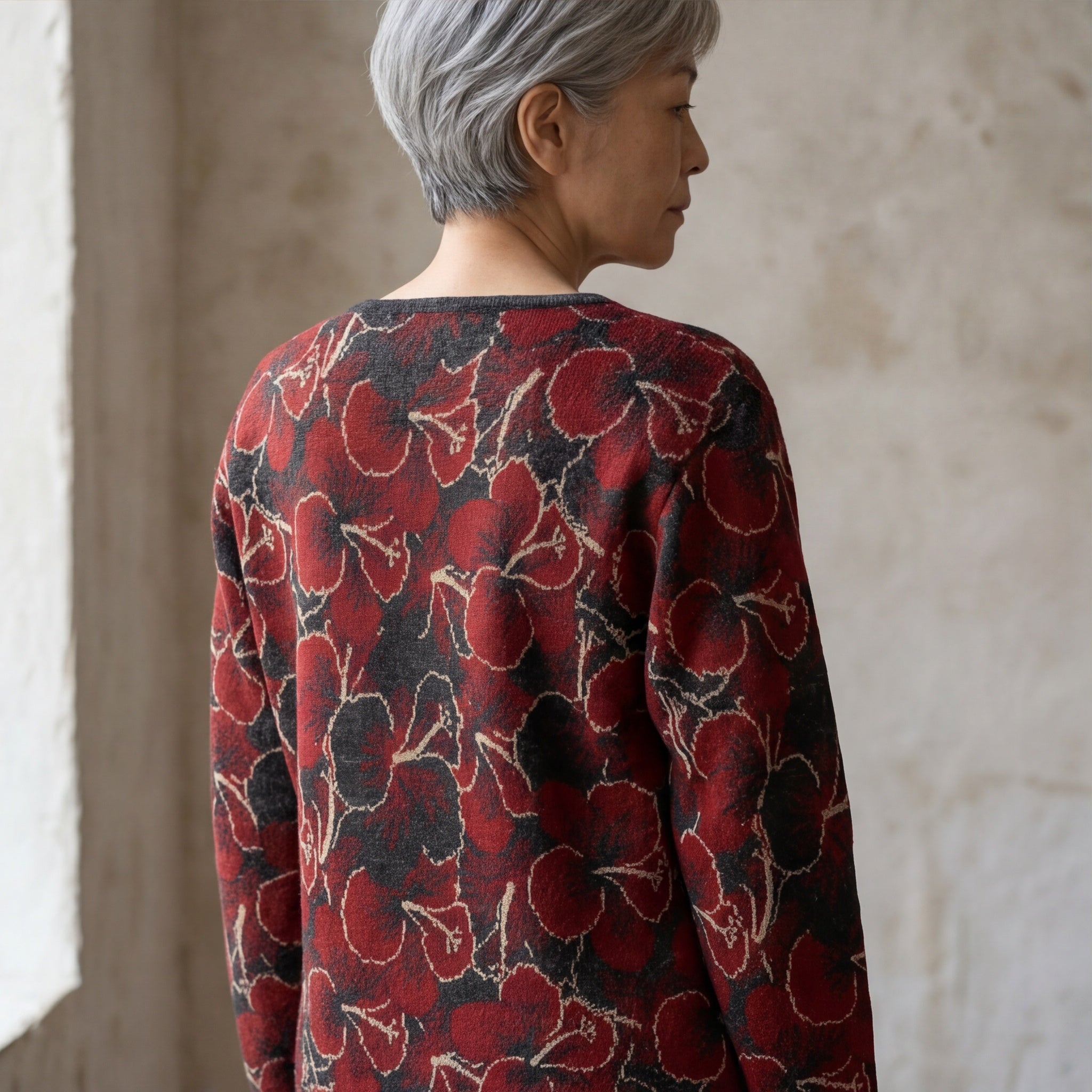 Soft alpaca floral sweater in red and charcoal tones