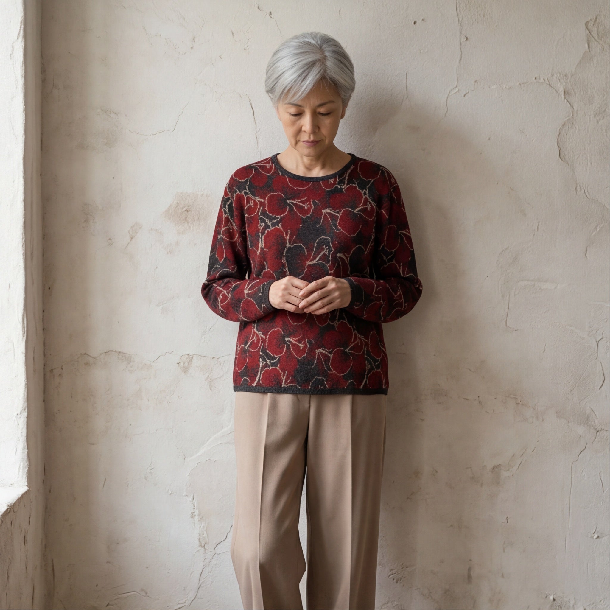 Women’s alpaca sweater with bold red hibiscus flower pattern