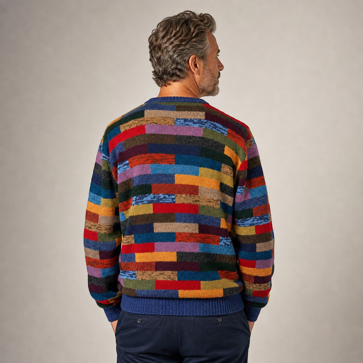 Man wearing colourful Baby Alpaca intarsia knit sweater