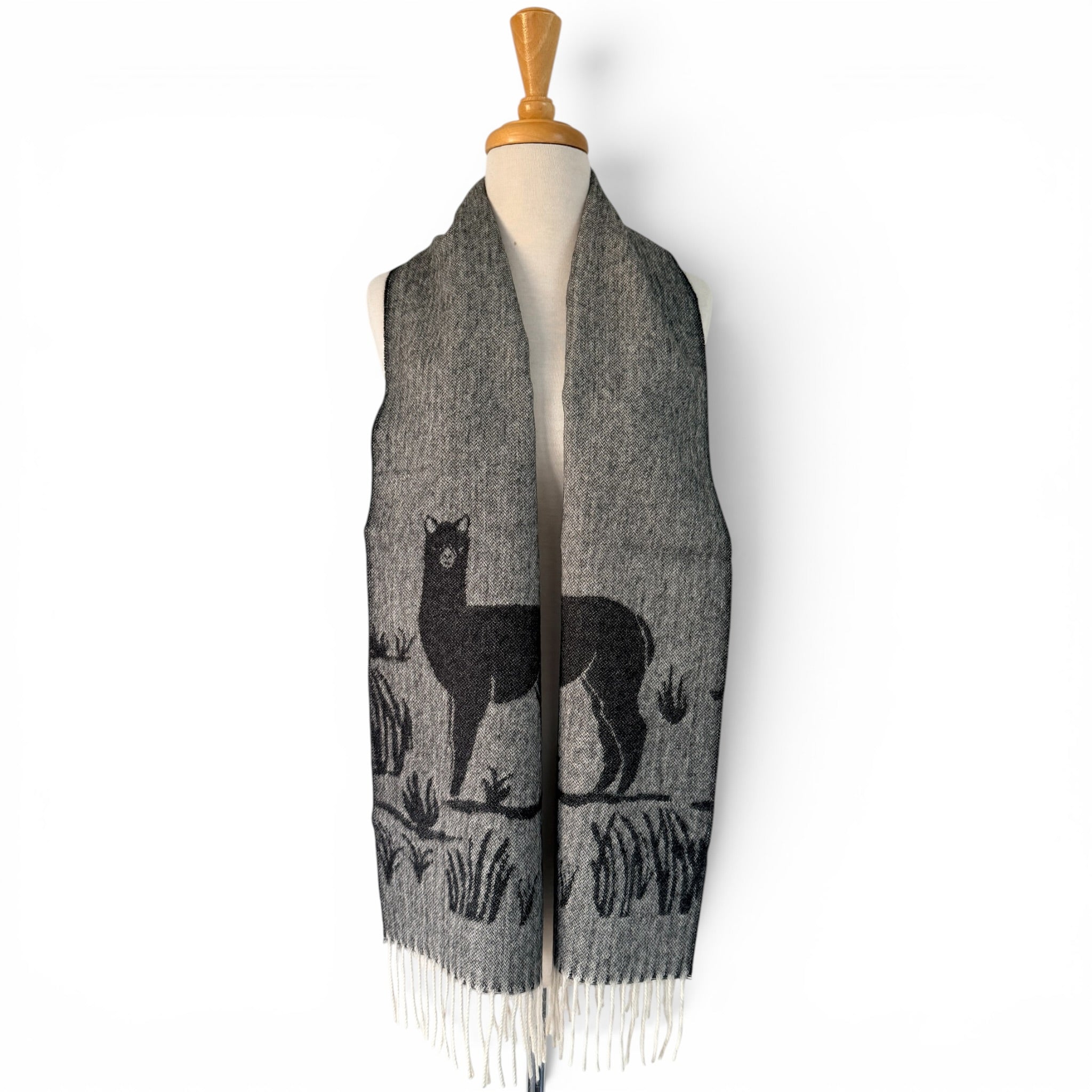 Woven alpaca motif scarf in a classic black and white colour combination