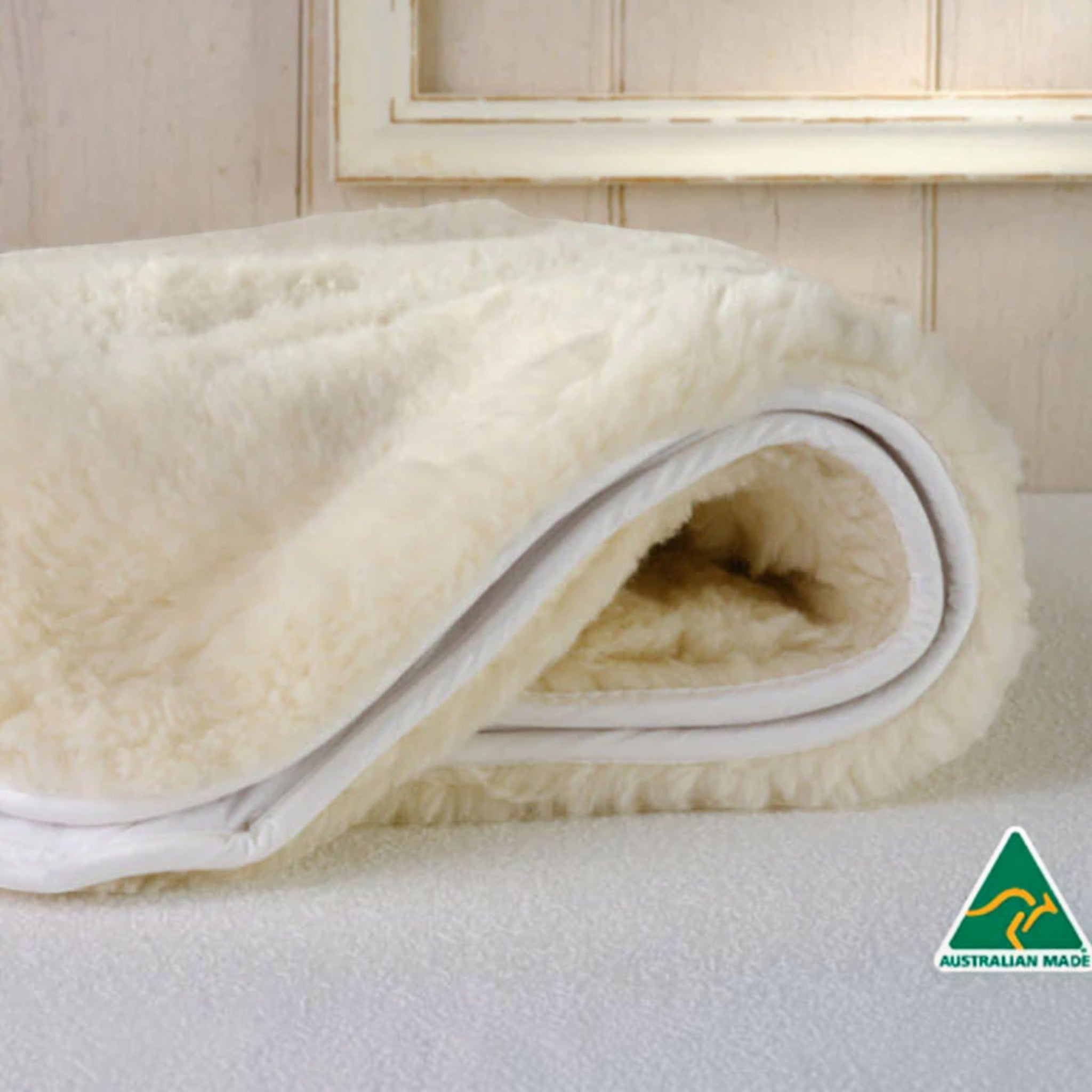 Roll of white alpaca rug with 'Australian Made' logo in the corner.