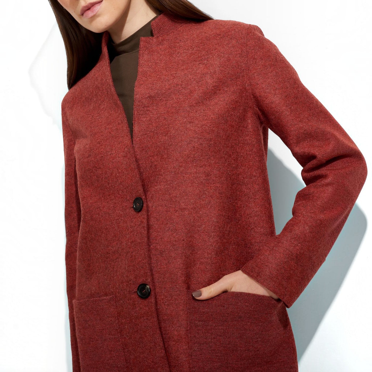 Kuna Zybil women’s coat in Sandalo red shown from the front and back