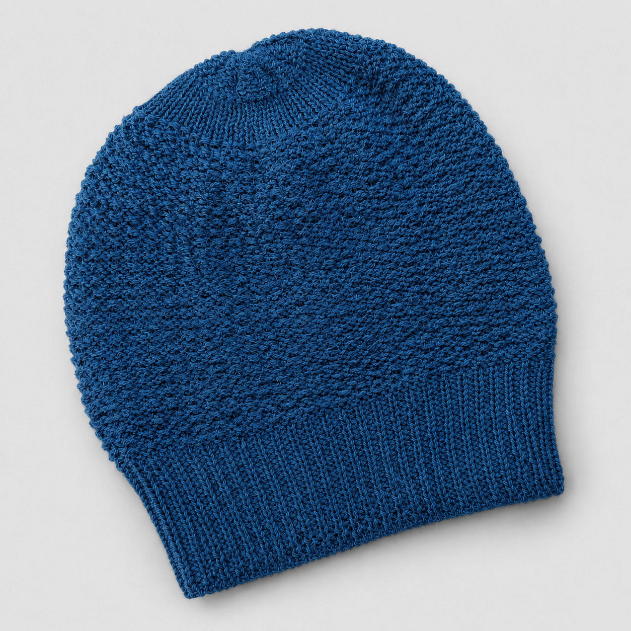 Blue knitted alpaca beanie soft winter layering piece