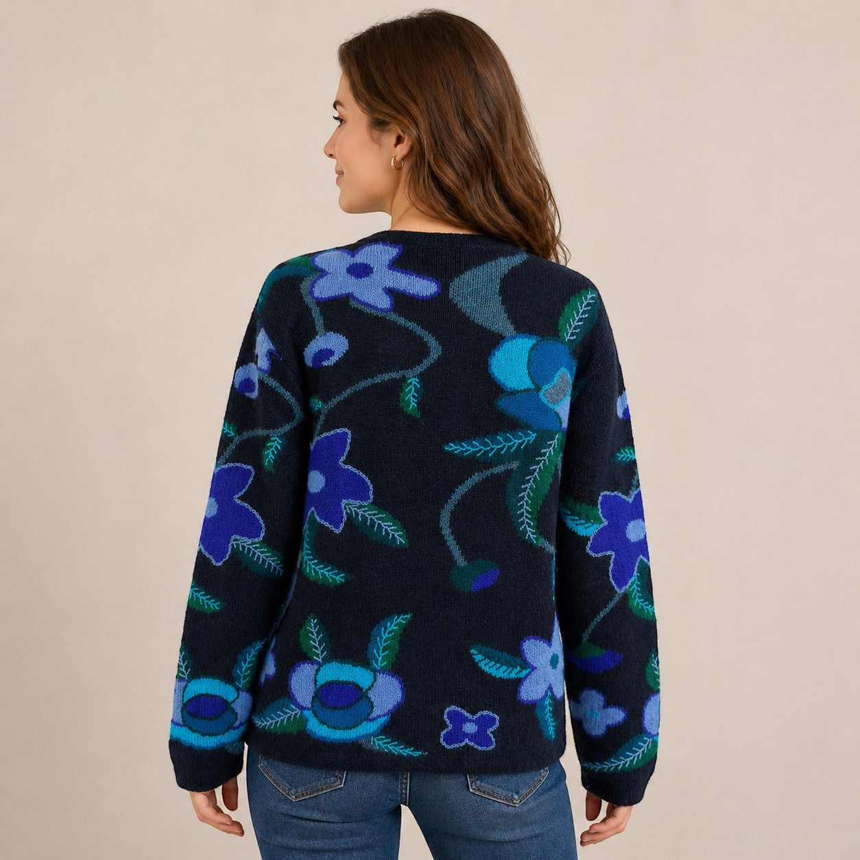 Woman wearing a navy alpaca cardigan  with blue floral patterns from Australian Alpaca Barn