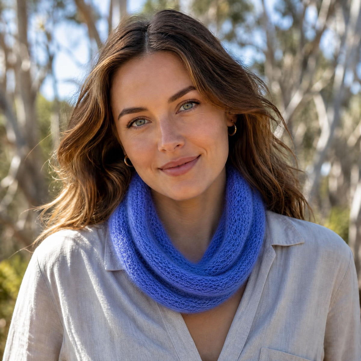A woman outdoors wearing a Alpaca & Silk infinity scarf.