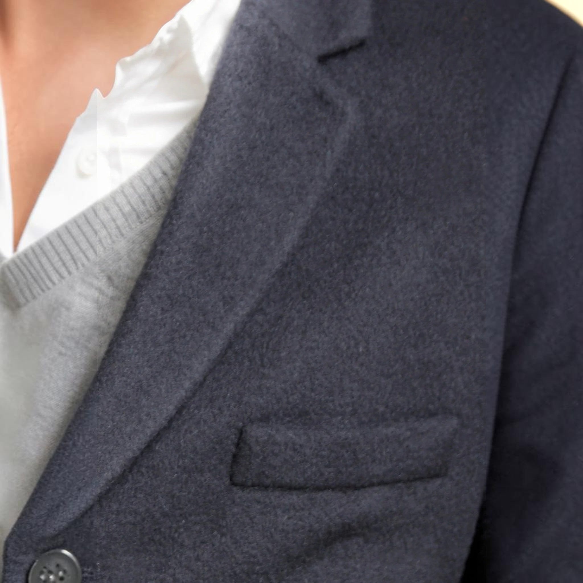 Close-up of the Nars coat showing soft dark blue alpaca texture