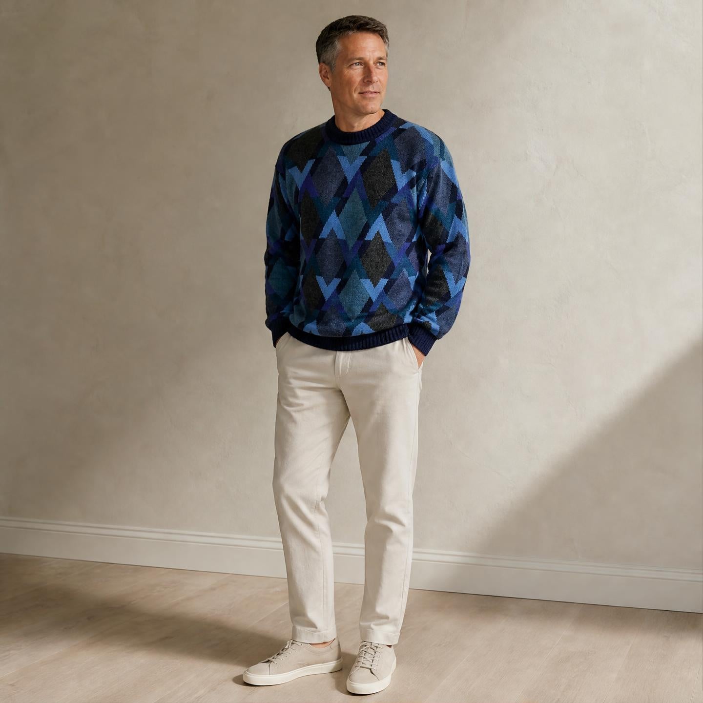 Model wearing Men’s multicolour blue alpaca sweater with geometric pattern