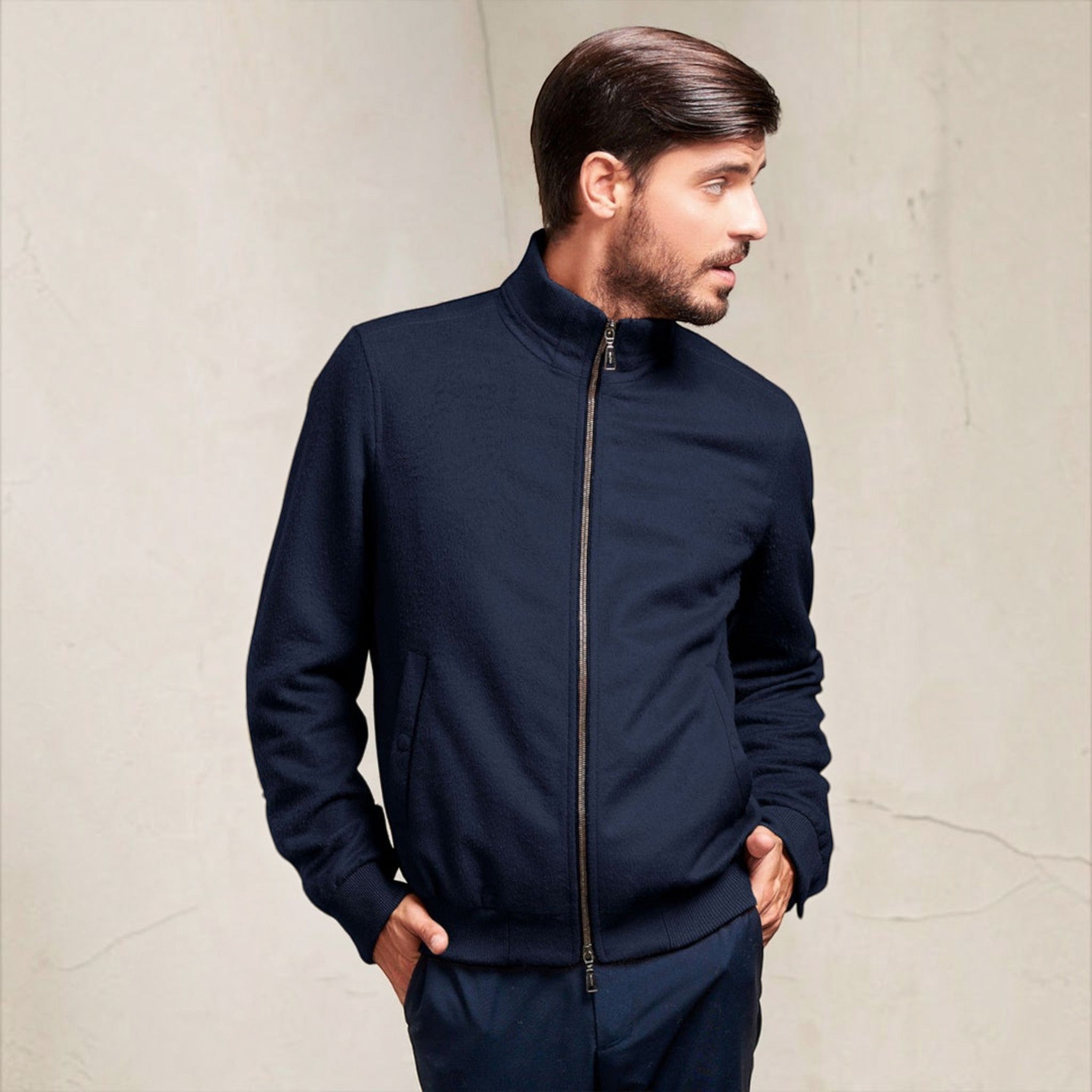 Man wearing the Nadrian Baby Alpaca Jacket with full-zip front in Blue
