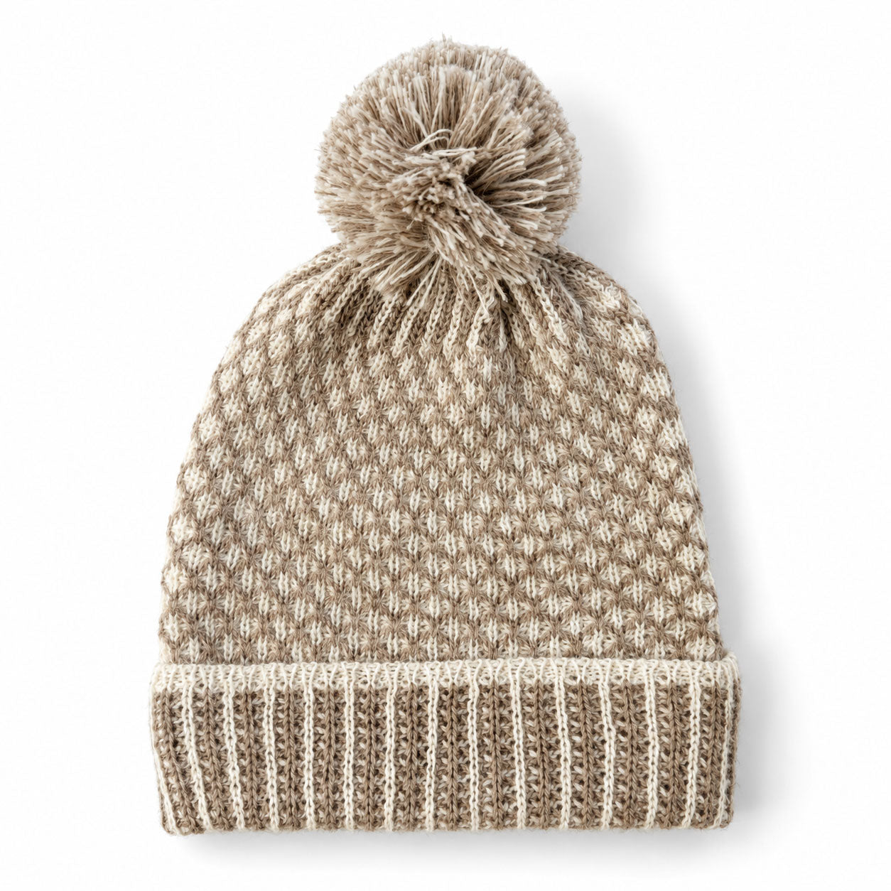 Soft Nogal beanie with coordinating pom pom and ribbed turned-up cuff.