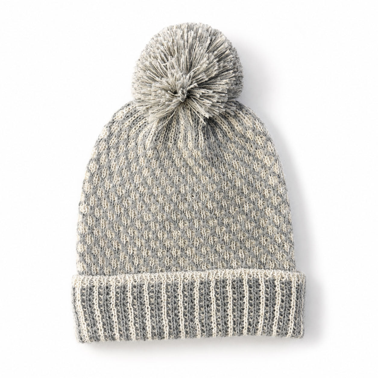 Nogal Baby Alpaca beanie with detachable pom pom and textured beehive knit.