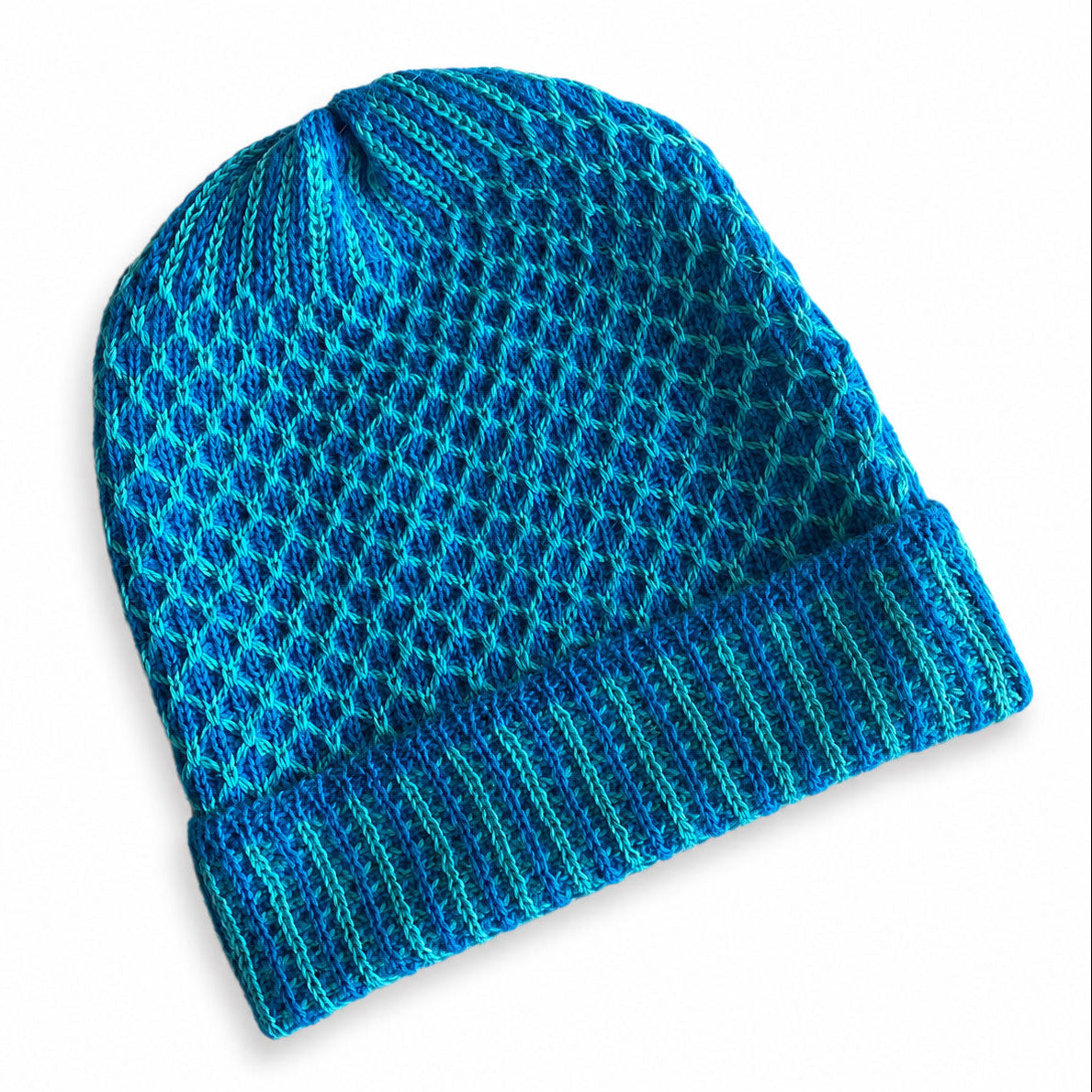 Two-tone Baby Alpaca beanie with textured knit and ribbed cuff.