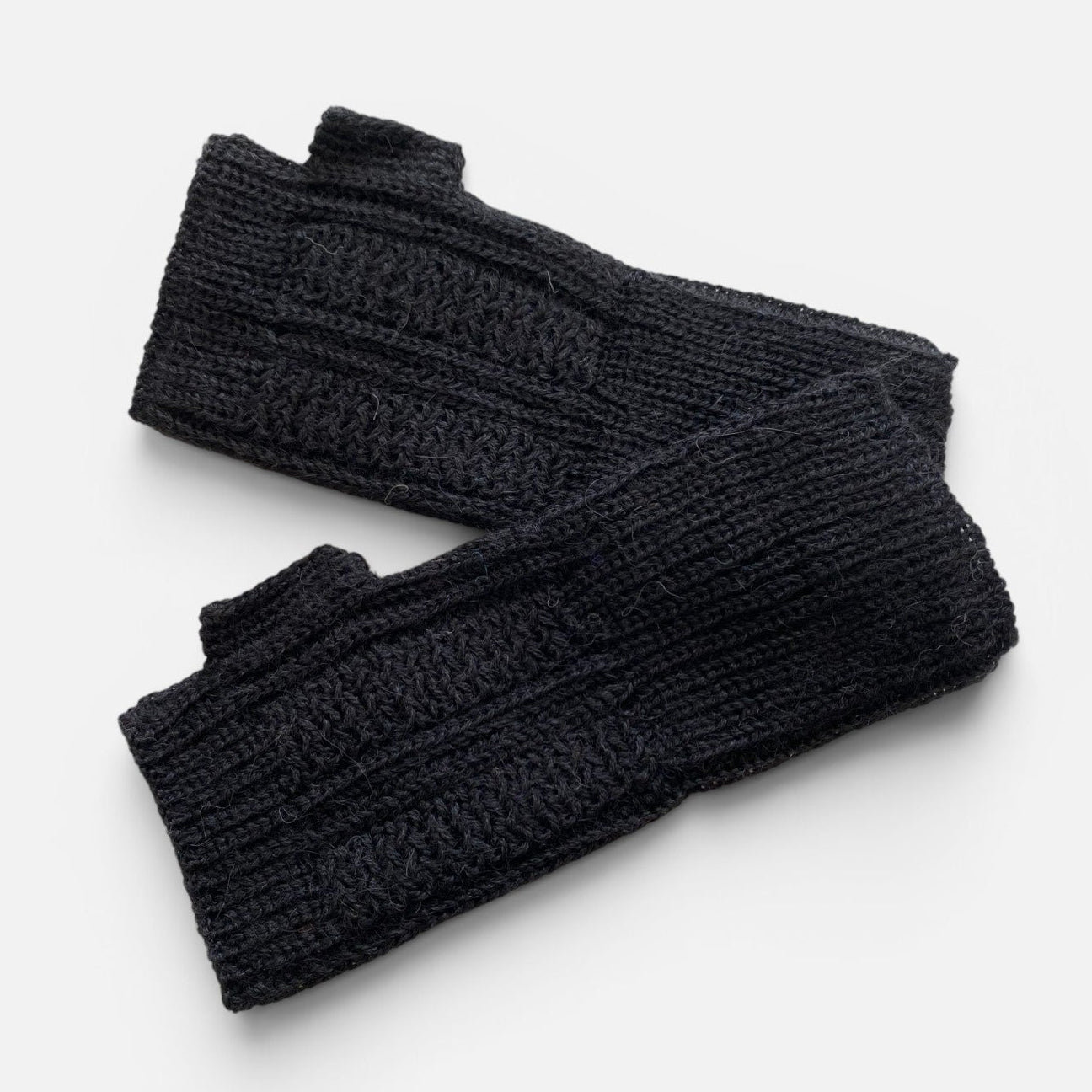 Black baby alpaca panel gloves with textured knit and fingerless thumb-hole design