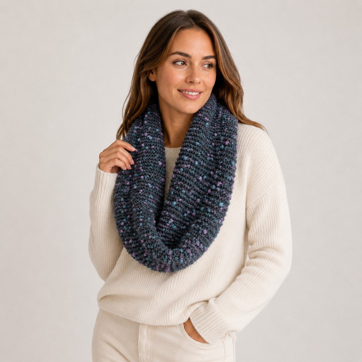 Hand-knitted grey Baby Alpaca PomPom snood with blue and lilac accents