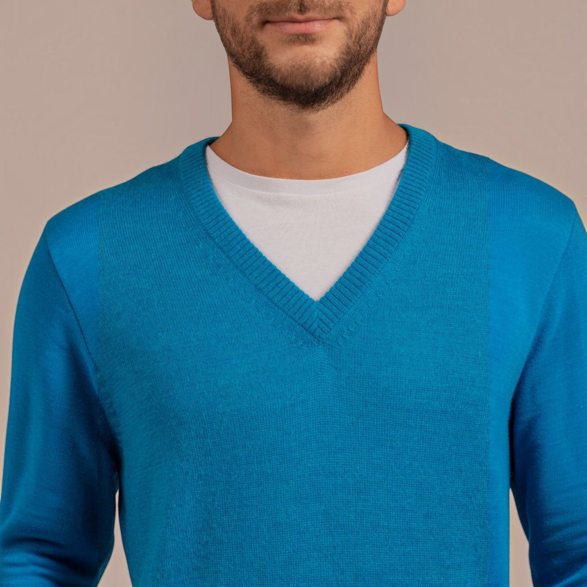 Male model wearing soft Kuna alpaca V-neck sweater