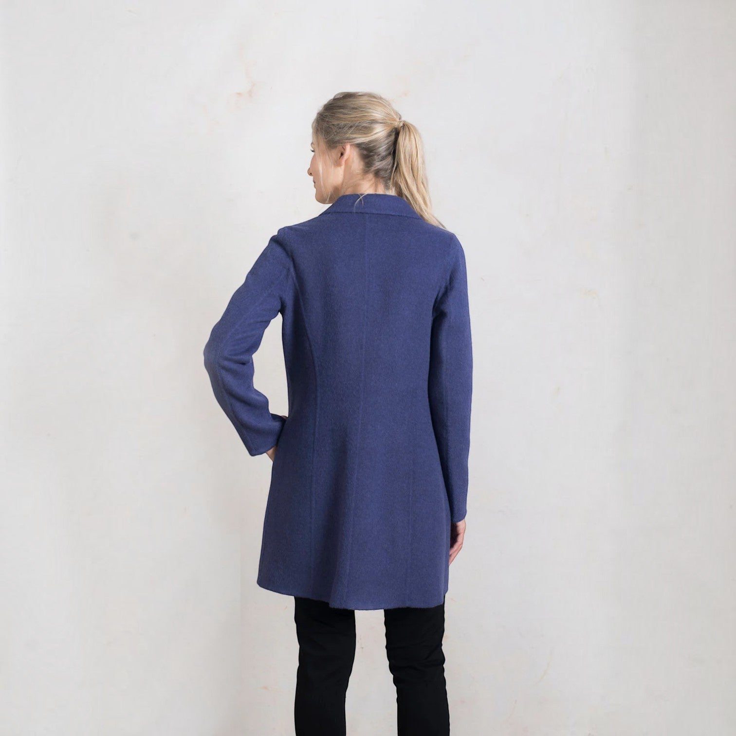 Back view of the Refugio Bluecorn baby alpaca coat with a gently flared silhouette