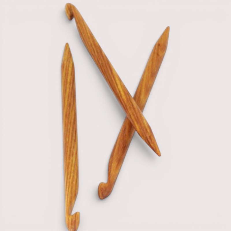Three wooden repair hooks for knitting or crochet.