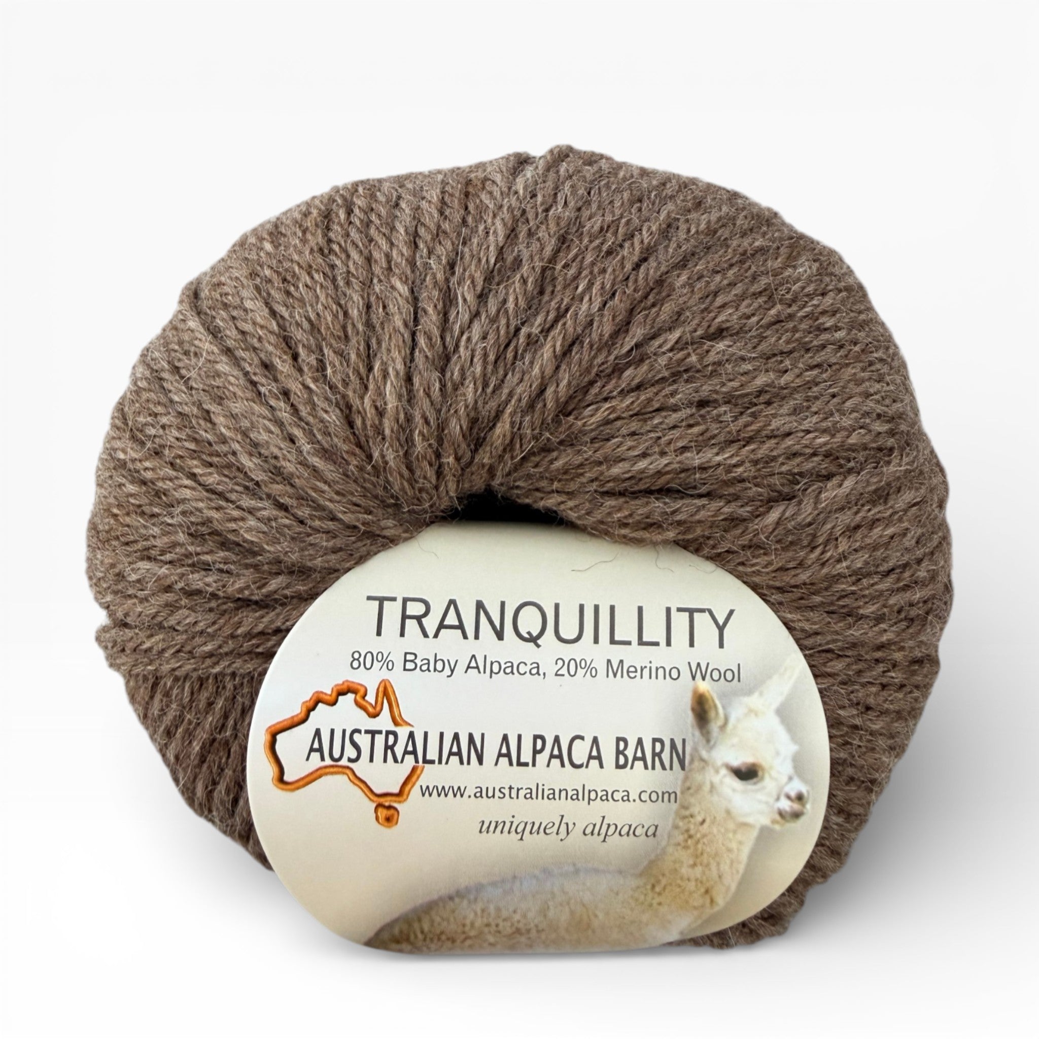 Brown yarn Alapca ball with 'Tranquillity' label on a white background