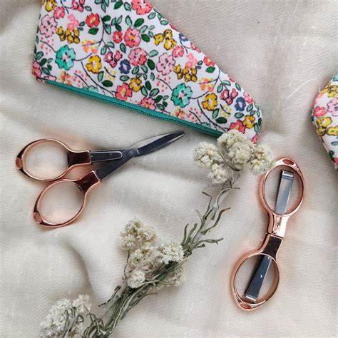 KnitPro gold folding scissors for cutting yarn and thread.