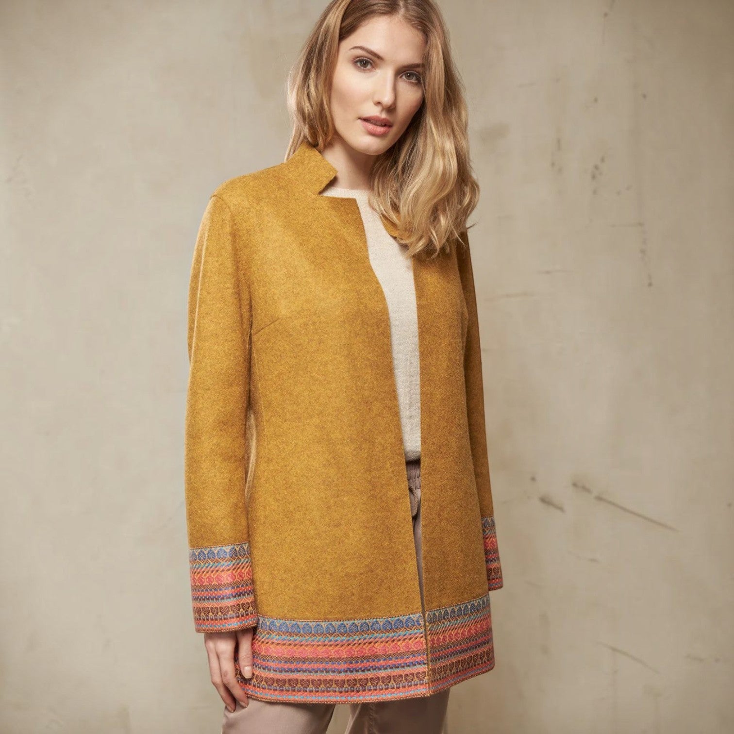 Women’s Sangria mustard alpaca wool coat with colourful Andean-inspired trim