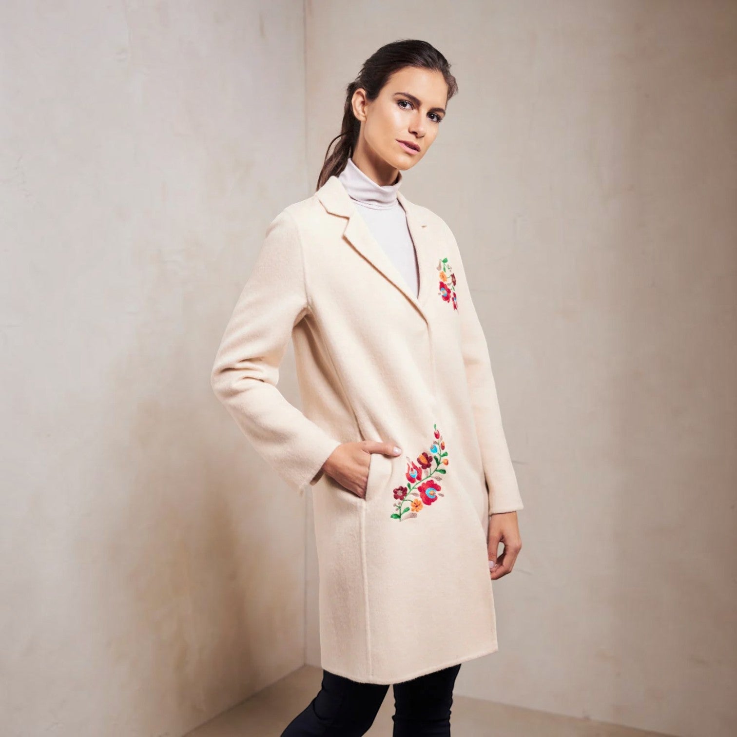 Women’s Selina cream baby alpaca coat with colourful floral embroidery and side pockets