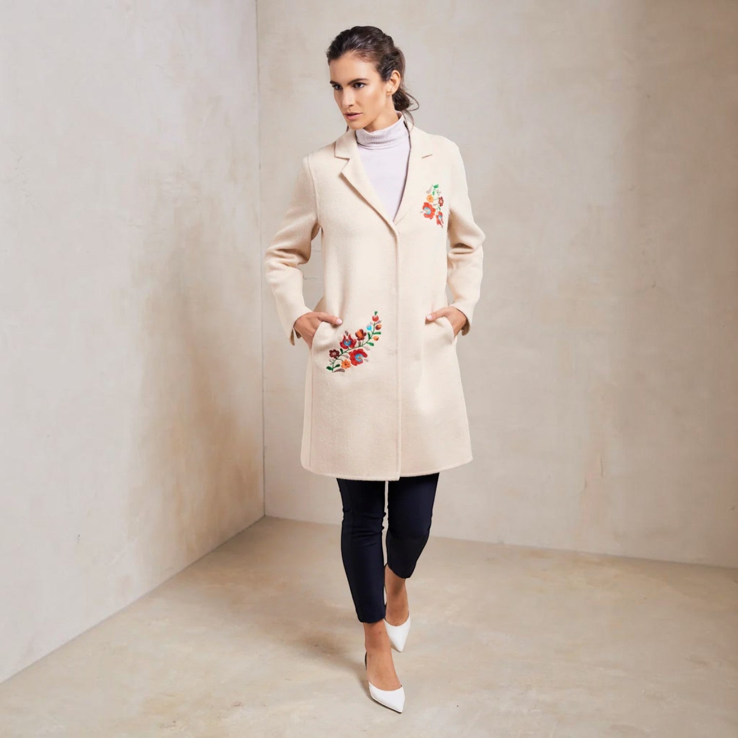 Full-length front view of the Selina embroidered baby alpaca coat in Doeskin cream