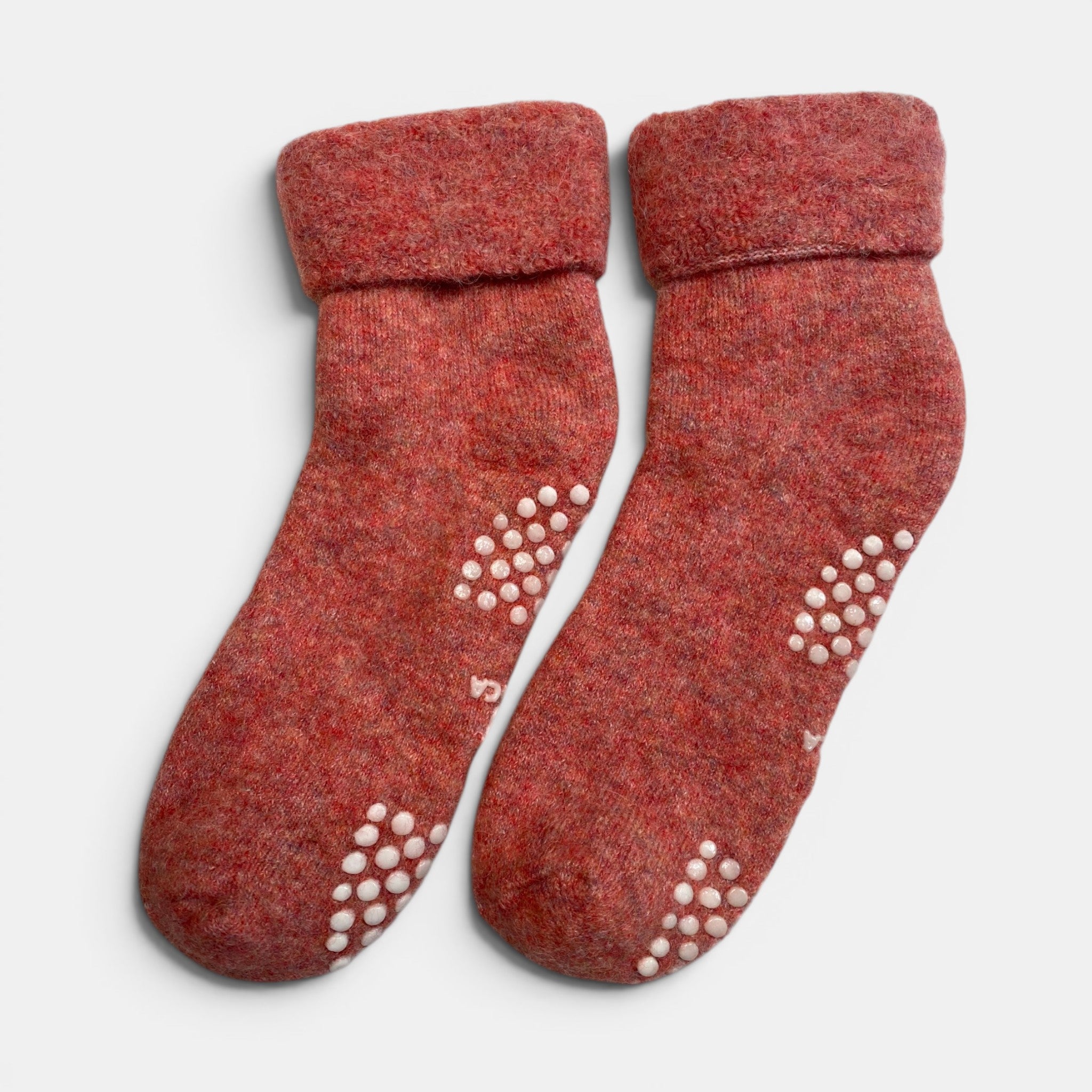 Luxury alpaca slipper socks in pink tones, non-slip socks for home.