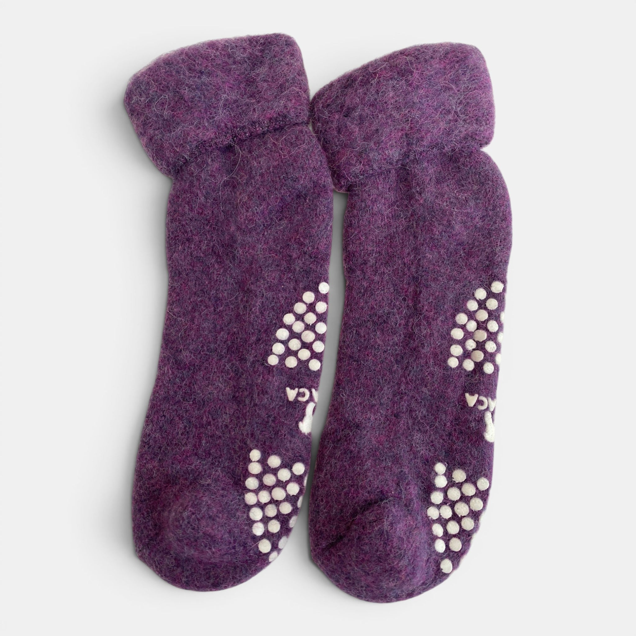 Alpaca wool slipper socks in purple with grippy soles, warm socks for lounging.
