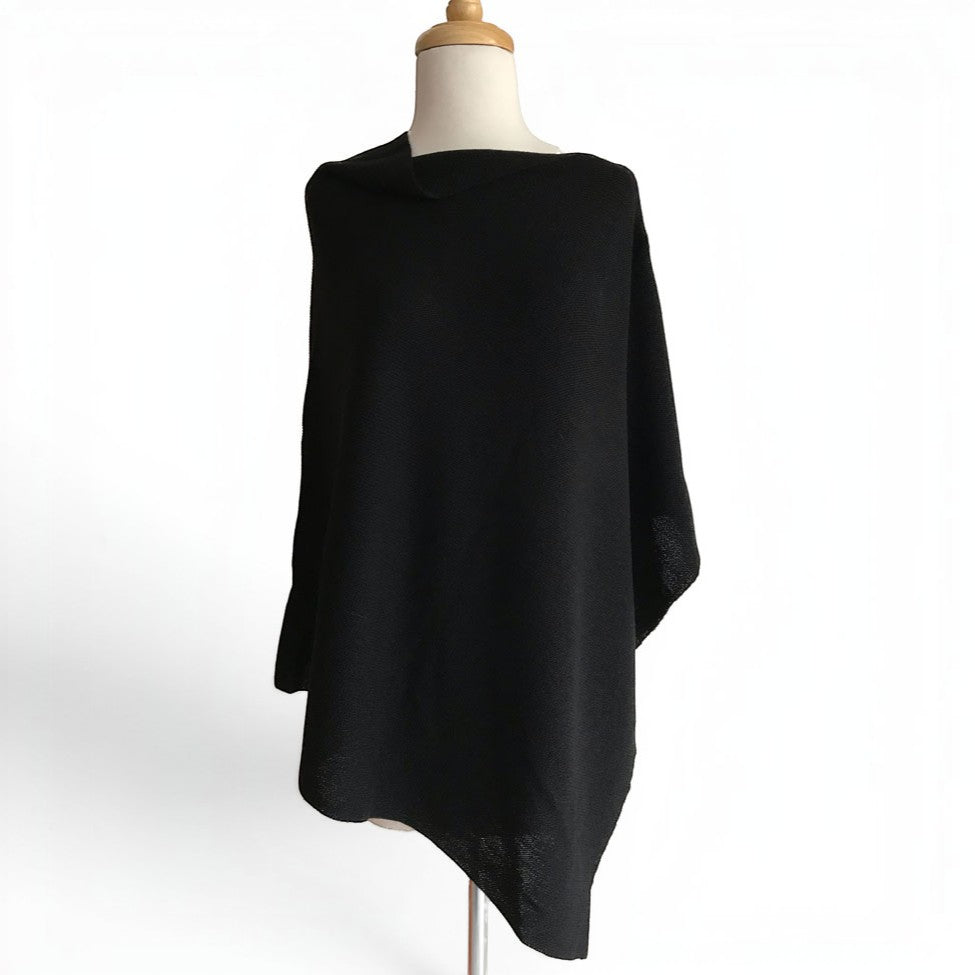 Black 100% alpaca links-knit poncho displayed on a dress form