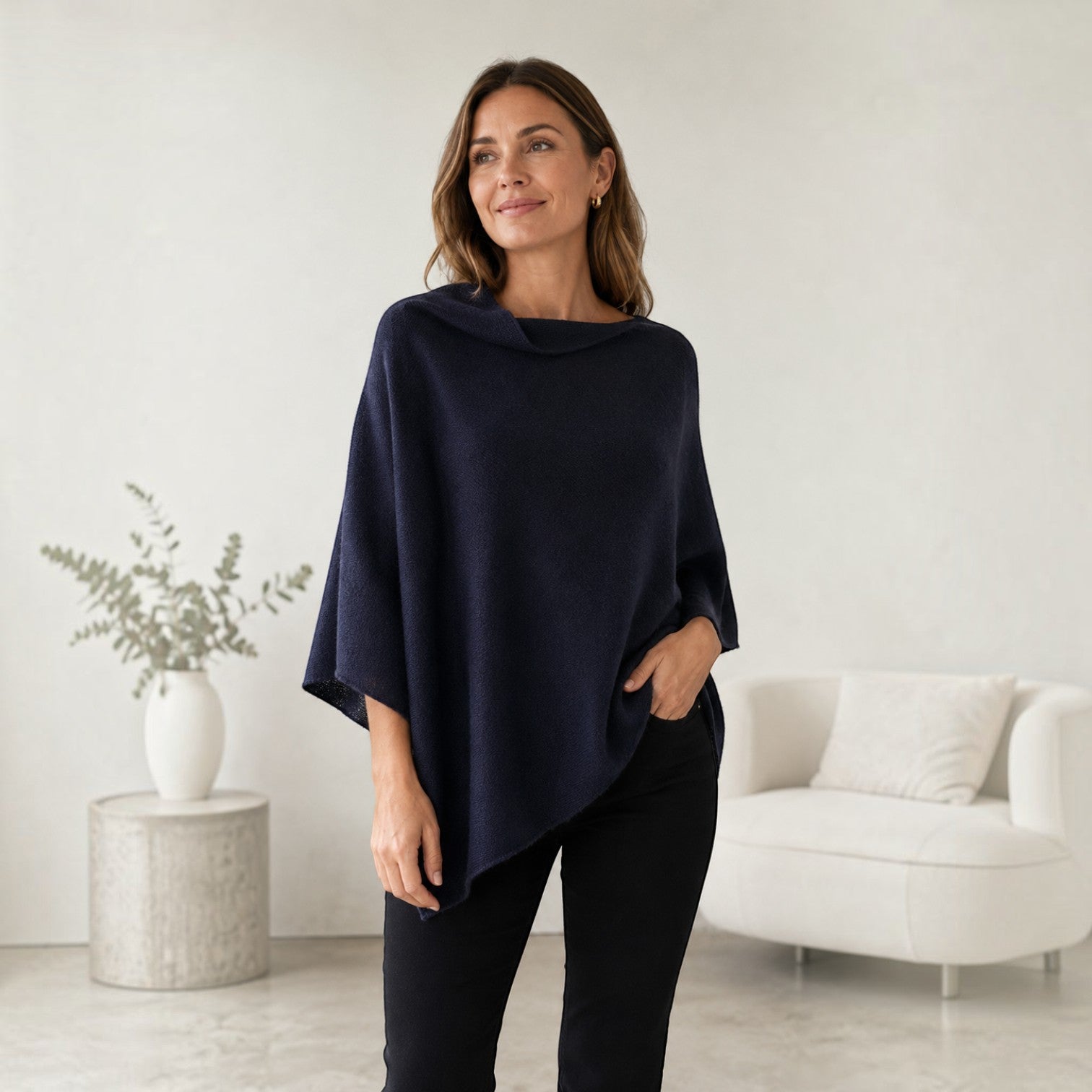 Navy 100% alpaca links-knit poncho styled with black trousers