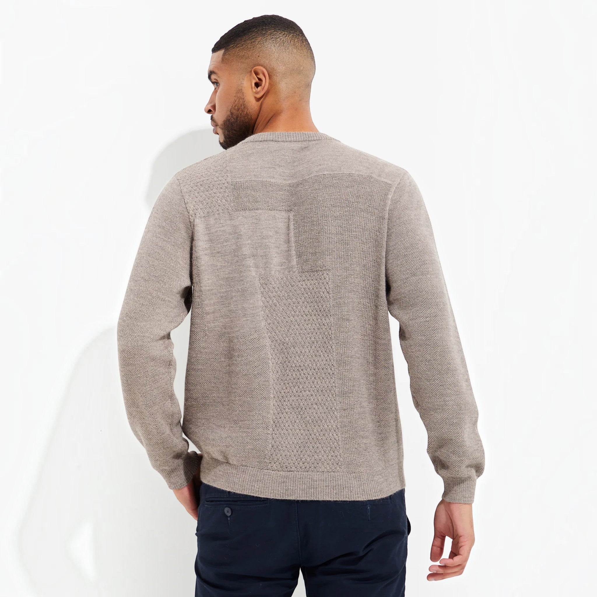 Male model wearing soft alpaca sweater by Kuna
