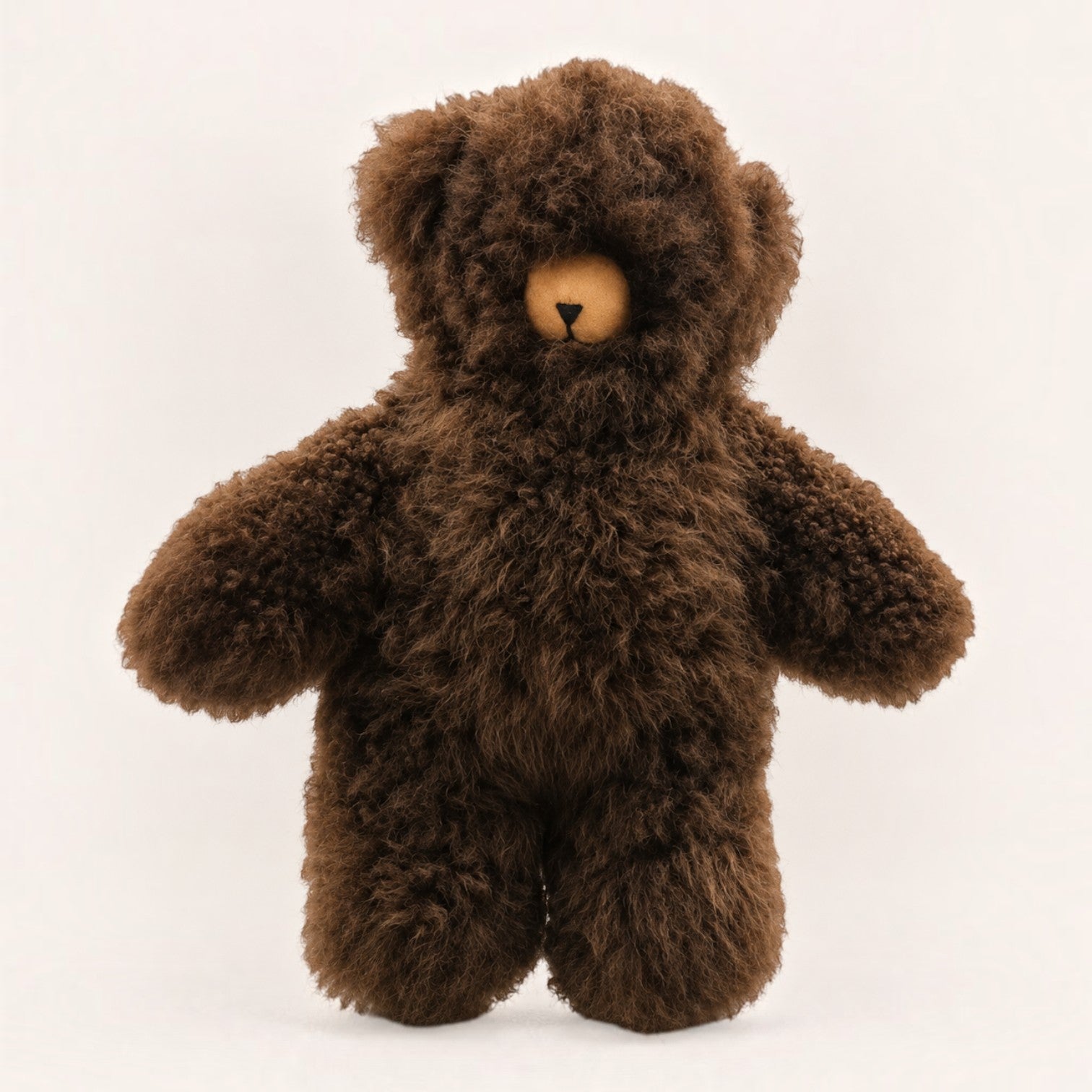 A classic brown Baby Alpaca teddy bear with a soft, curly brown fur texture, featuring a contrasting light tan snout and black nose..