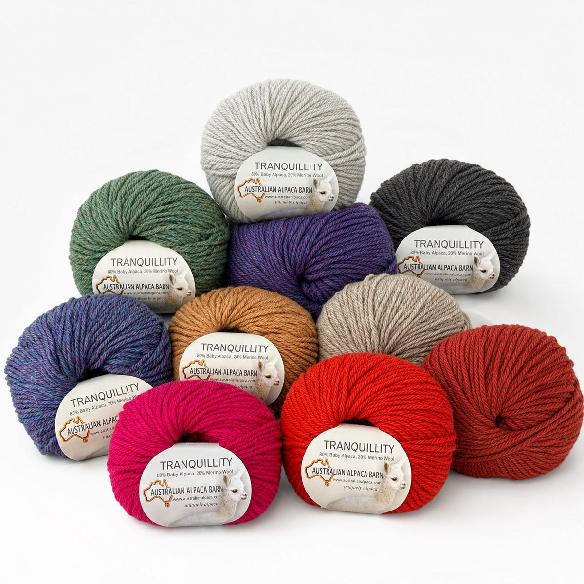 Assorted colors of Tranquillity alpaca yarn on a white background