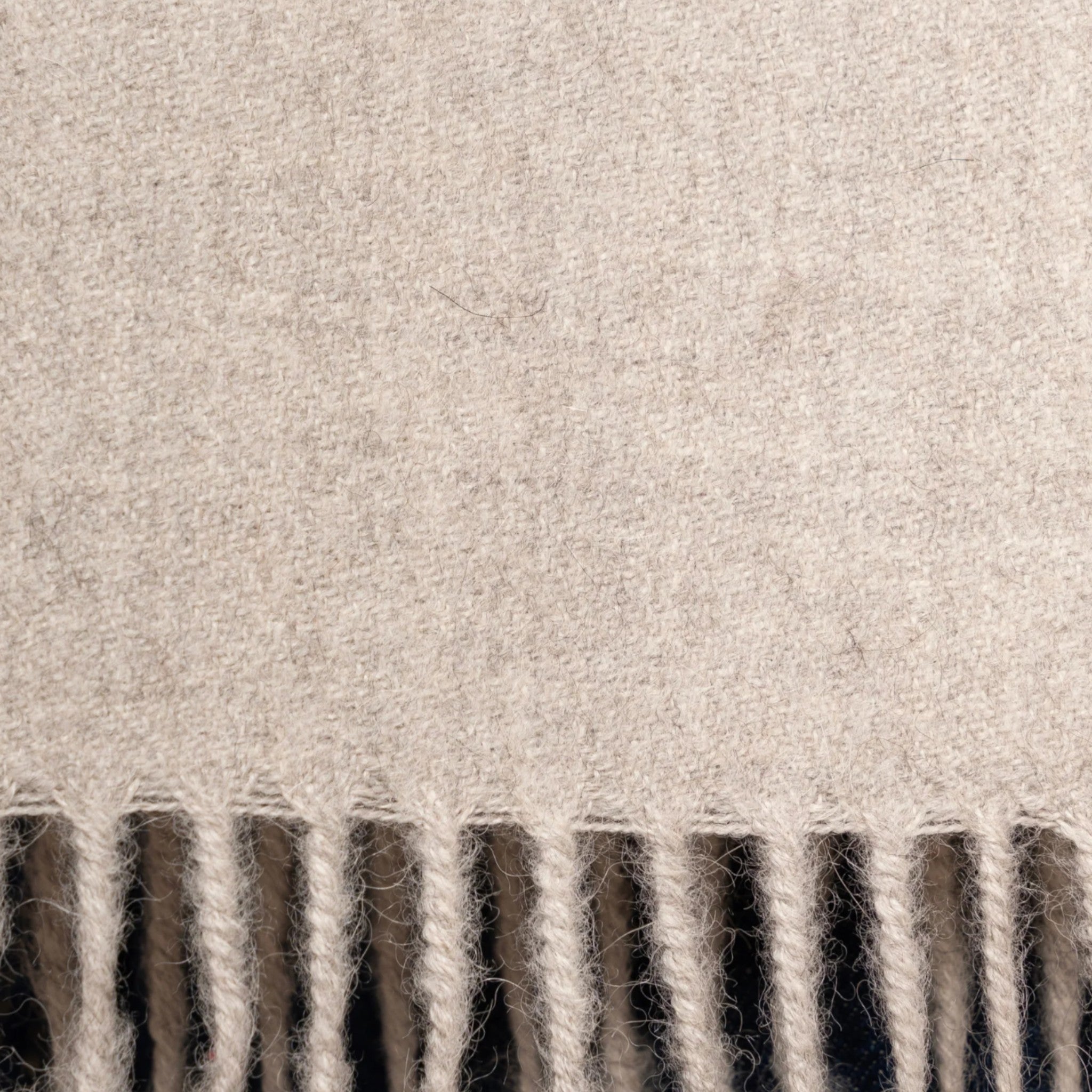 Close Up Undyed light grey alpaca scarf with lightweight warmth and classic fringed ends