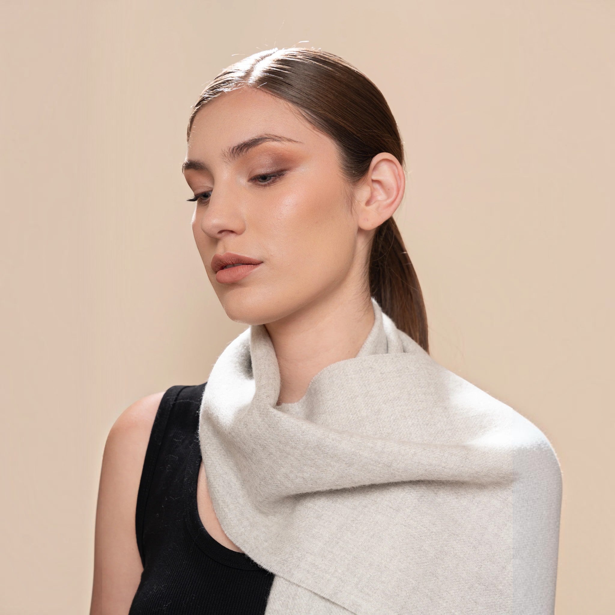100% Baby Alpaca Eco scarf in natural light grey, styled long with elegant drape