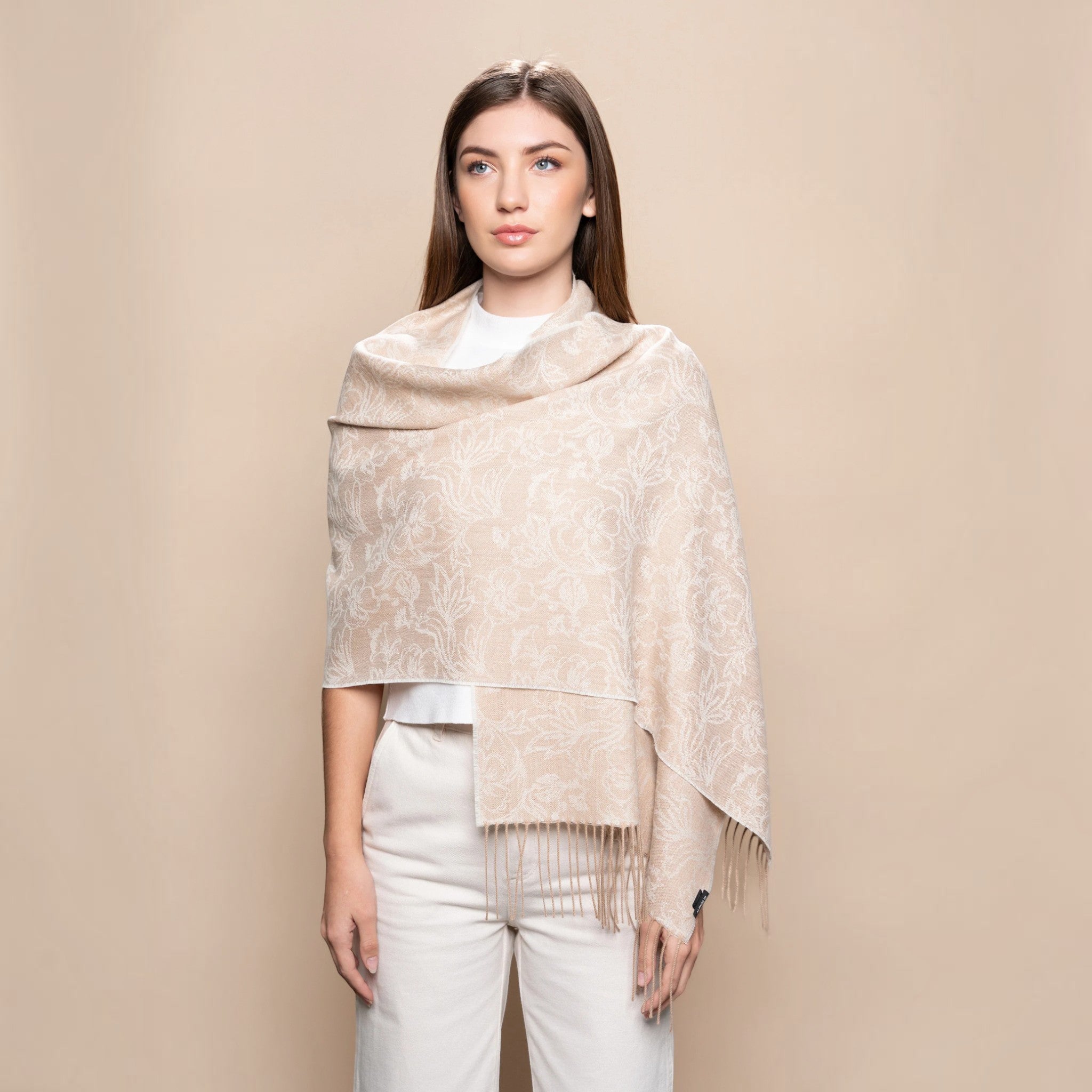 Undyed coral beige Baby Alpaca scarf styled as a wrap with elegant floral jacquard pattern