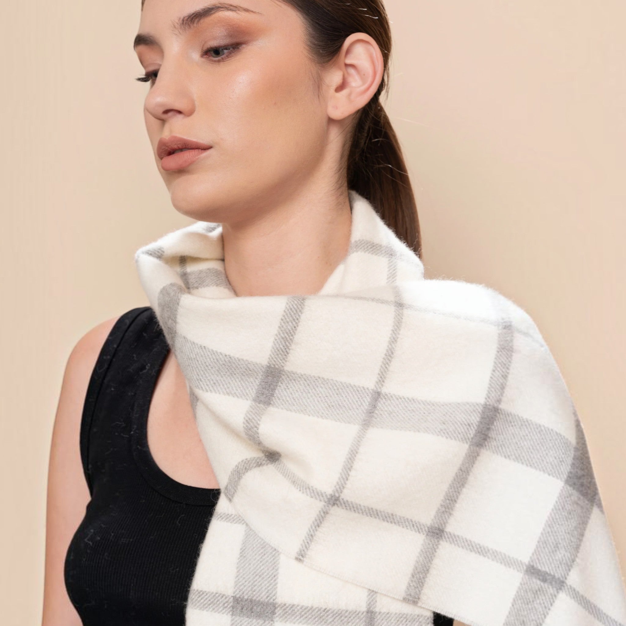 Soft ecru and light grey Baby Alpaca Eco plaid scarf styled long with a classic check design