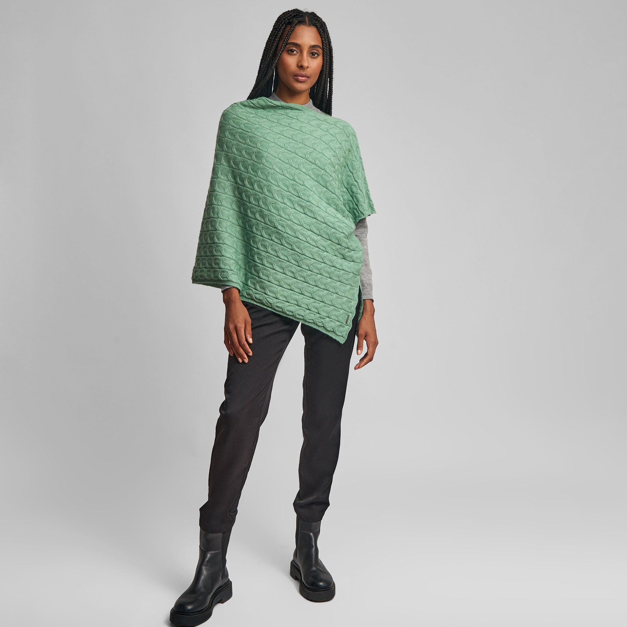 Soft textured Willow Poncho in basil green on a female model
