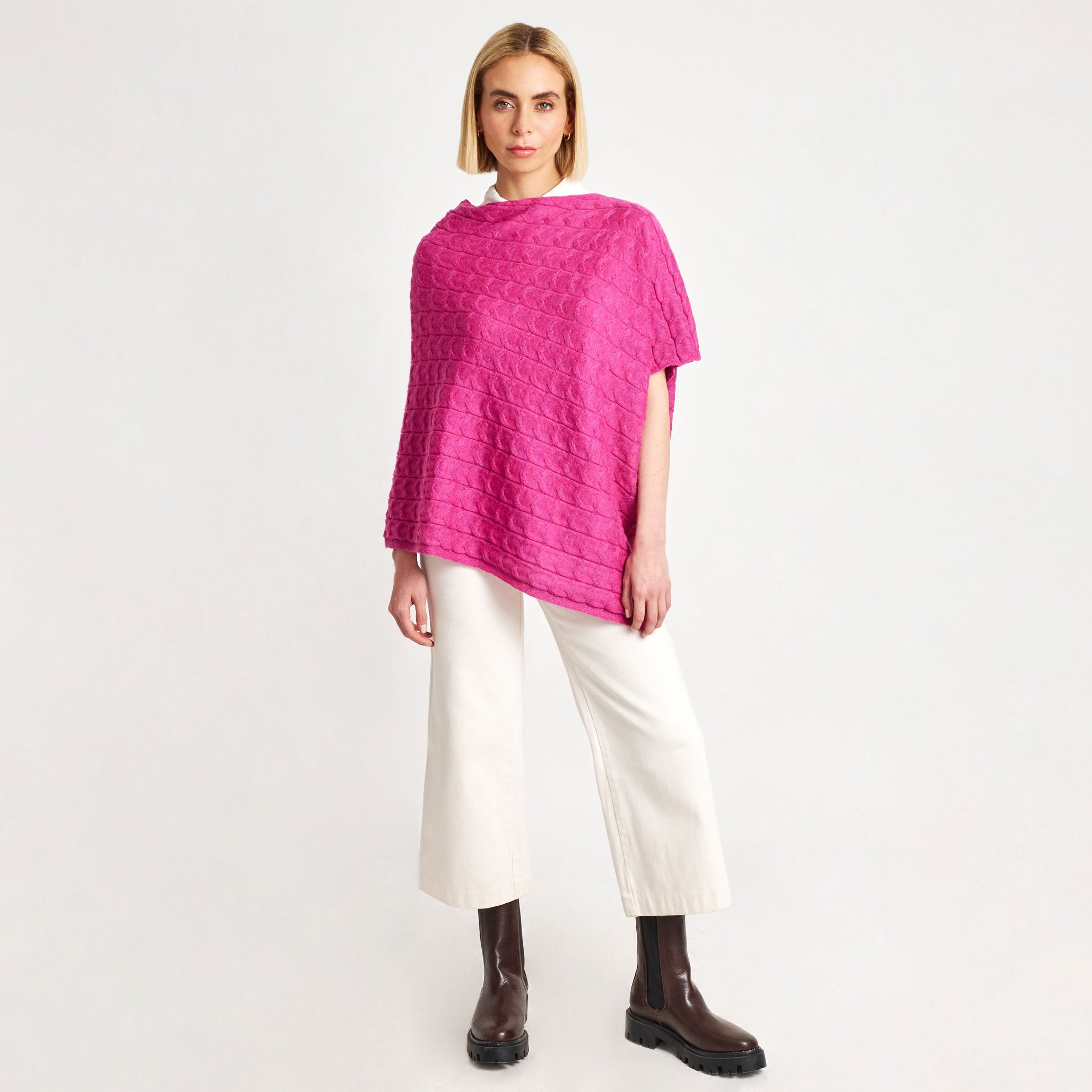 Ceremony pink alpaca poncho with textured knit and asymmetric hem