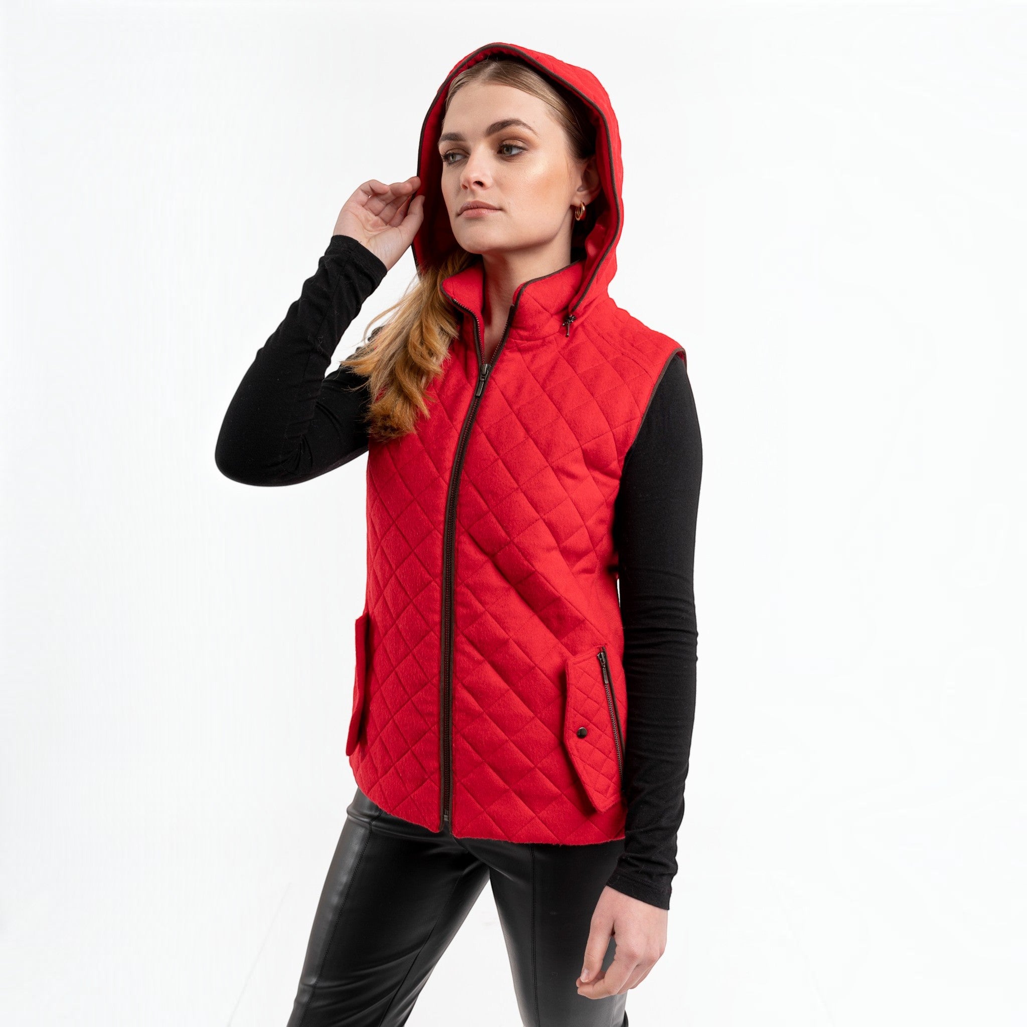 Red alpaca blend vest styled with black trousers and zippered pockets