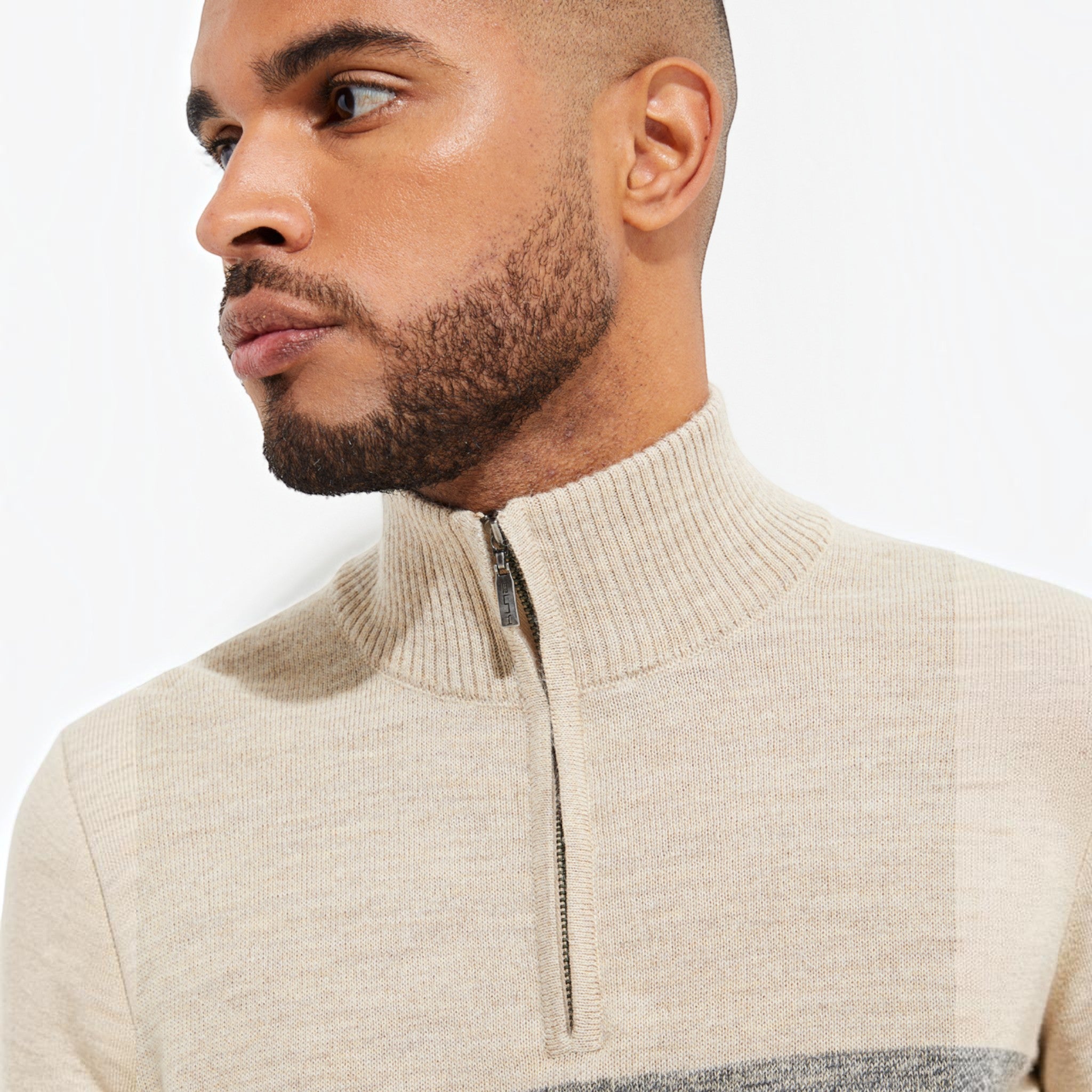 Close-up of men’s Lluvia Baby Alpaca quarter-zip sweater and ribbed collar