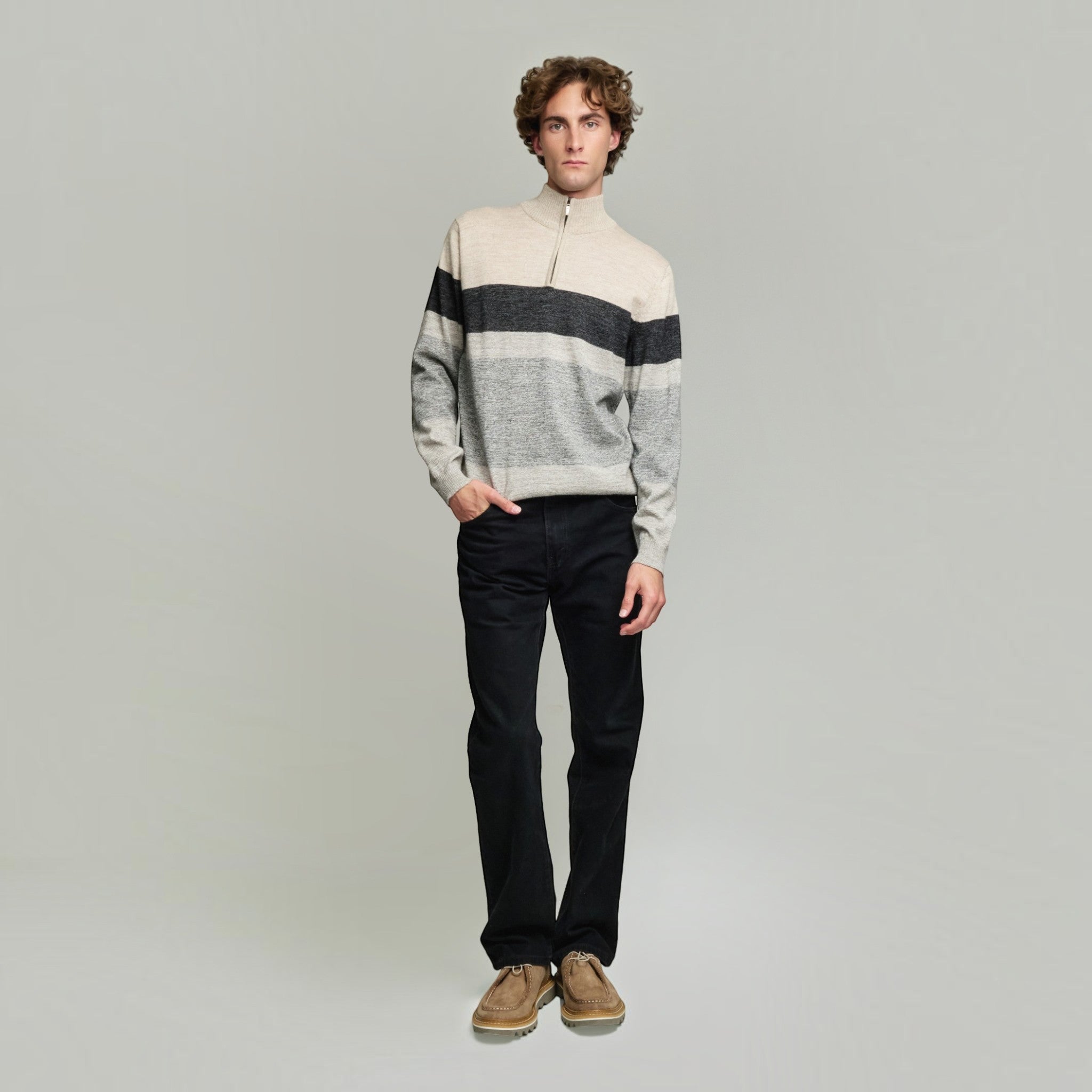 Model wearing the Yonas 100% Baby Alpaca quarter-zip sweater in mocha
Soft men’s alpaca sweater in neutral mocha and grey with a high zip collar